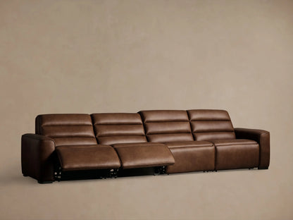 Close-up of rich brown leather Borough Motion Sectional with visible stitching and embedded metallic motion control buttons.