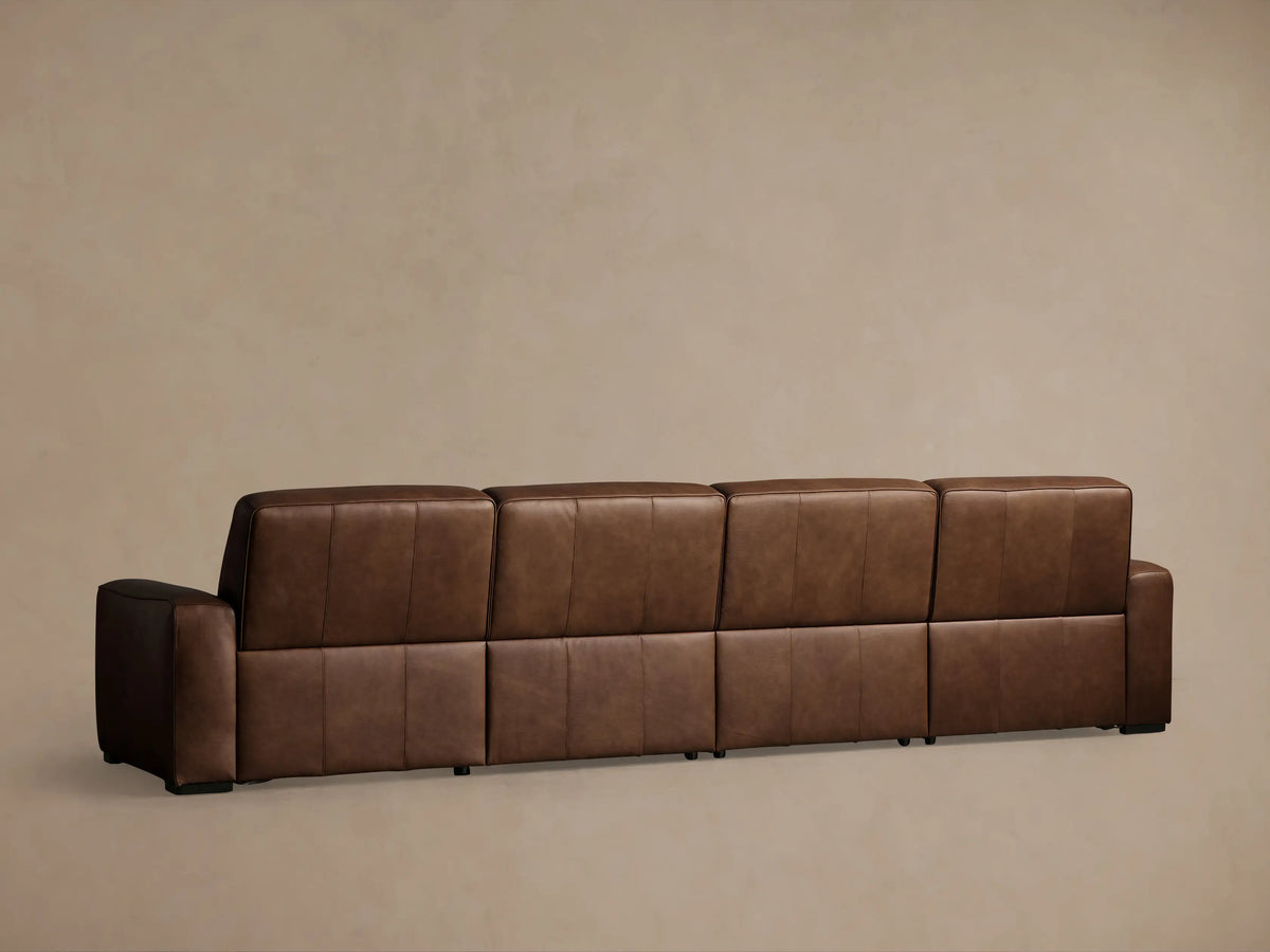 Borough brown leather 4-piece motion sectional, left side upright, right two seats reclined with footrests extended.