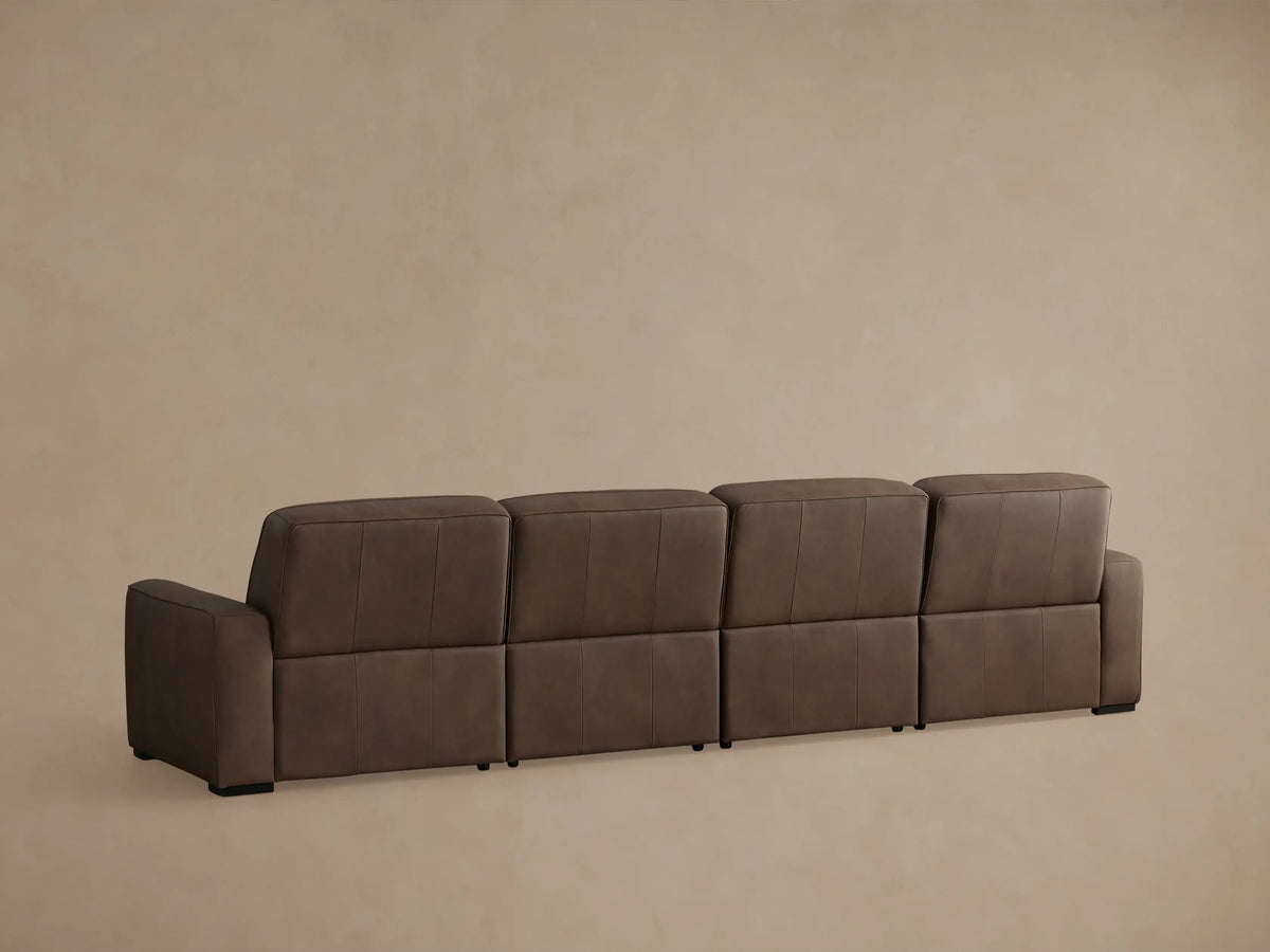 Dark brown Borough Leather Motion Sectional, left recliner extended with footrest up, soft leather texture visible.
