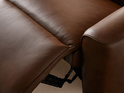 Angled close-up of the Borough Leather Motion Recliner's rich brown leather, ribbed backrest, and smooth seat cushion.