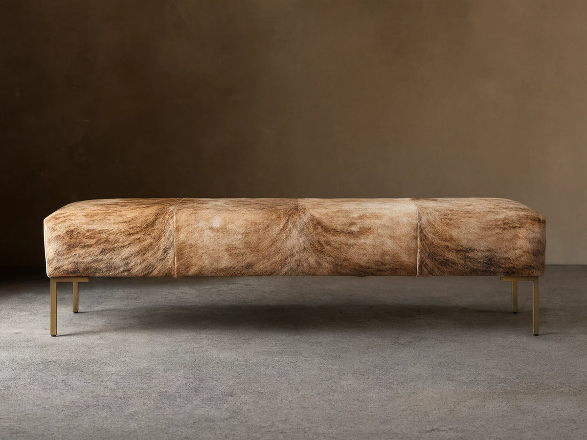 Tilton Hair on Hide Bench with natural tan and brown color variations, featuring metal legs, set against a neutral background.