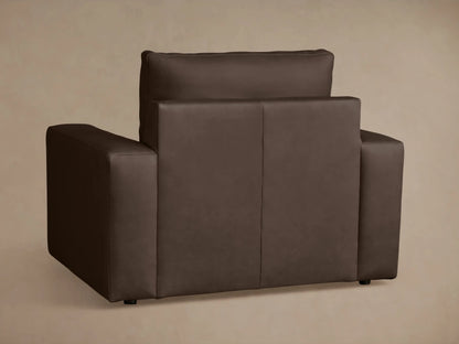 Brown leather Kipton Wide Arm Recliner top view, showing wide armrests, plush seat cushion, and slightly reclined backrest.