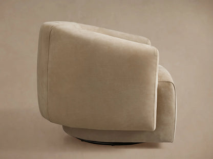 Hamlin Nubuck Leather Swivel Chair in beige, featuring a smooth, rounded backrest and plush armrest, close-up view.