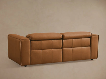 Coburn Leather Two-Piece Motion Sofa in tan leather, left recliner extended, smooth finish, detailed stitching, plush cushions.