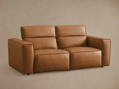 Coburn Leather Two-Piece Motion Sofa in tan leather, viewed from the back, showing dual recliners with stitching detail and smooth finish.