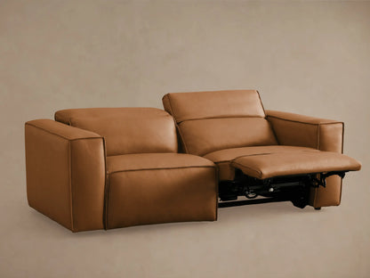 Two-piece Coburn Leather Motion Sofa in brown leather, featuring one left arm recliner extended, plush cushions, and sleek armrests.