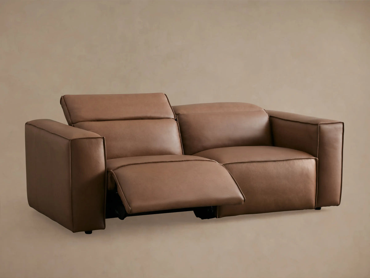 Coburn Leather Two-Piece Motion Sofa in brown leather, back view showing two-seat recliner design with plush cushions on each side.