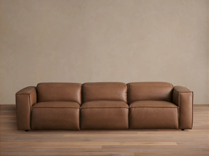 Coburn Leather Three-Piece Motion Sofa in brown leather finish, featuring three recliners with armrests on ends, positioned in a bright room.