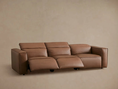 Coburn Leather Three-Piece Motion Sofa in brown leather with one recliner extended, featuring a modern design and plush seating.