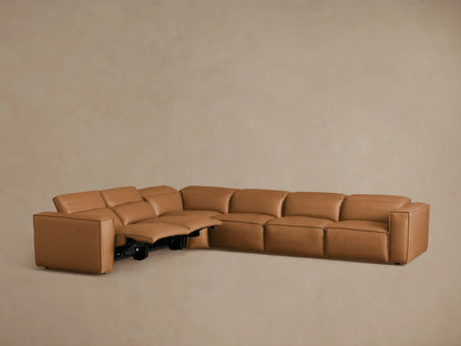 Coburn Leather Six Piece Motion Sectional in soft tan, featuring recliners and plush cushions, arranged in an L-shape.