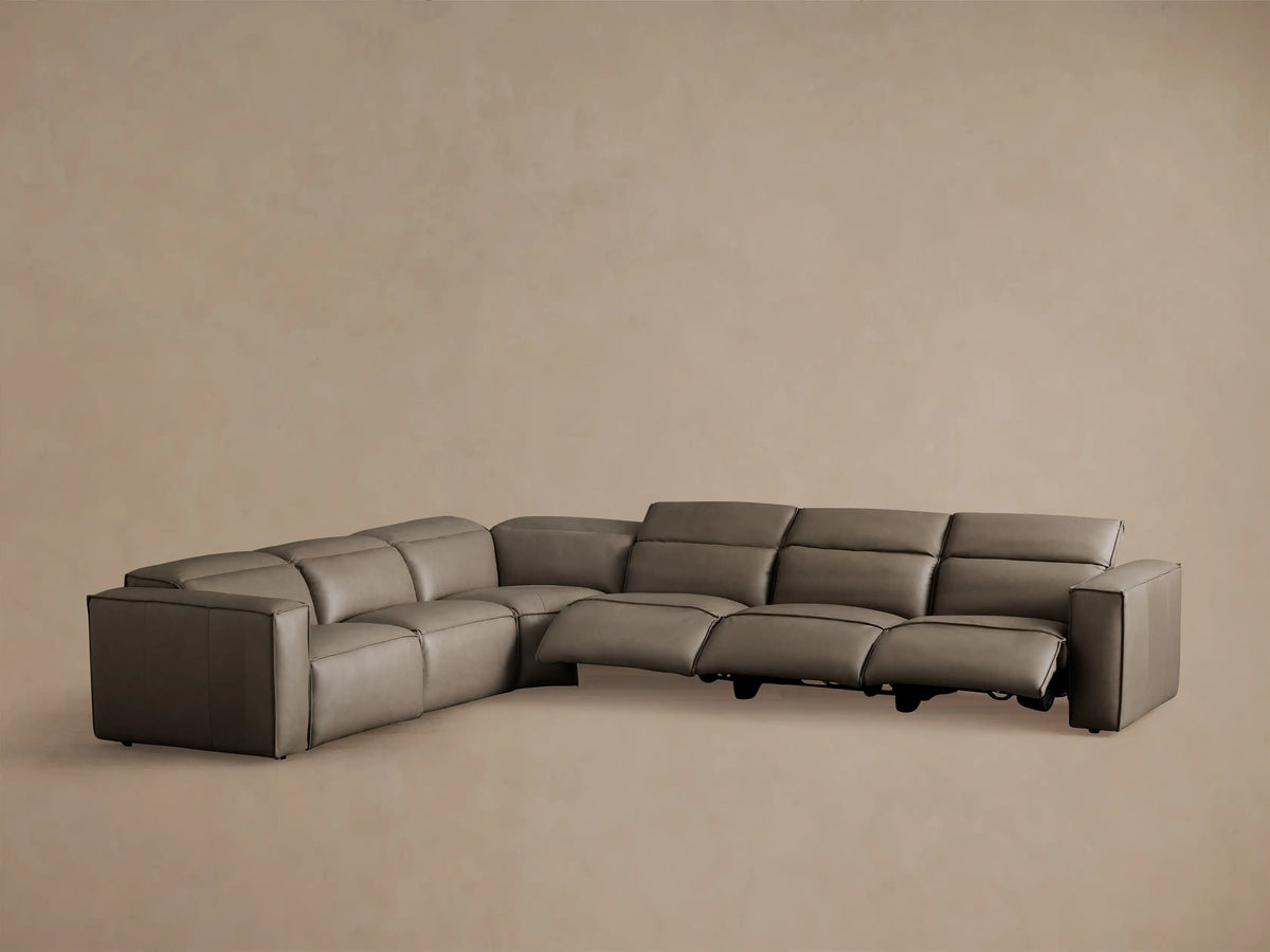 Coburn Leather Six Piece Motion Sectional in brown leather with a left arm recliner open; armless recliners and non-reclining corner visible.