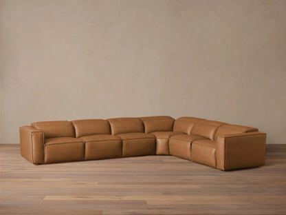 Coburn Leather Six Piece Motion Sectional in brown leather, featuring left and right arm recliners, positioned in a spacious room.