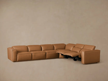 Coburn Leather Six Piece Motion Sectional in tan leather, L-shaped, viewed from rear. Features include visual grain, smooth surface.
