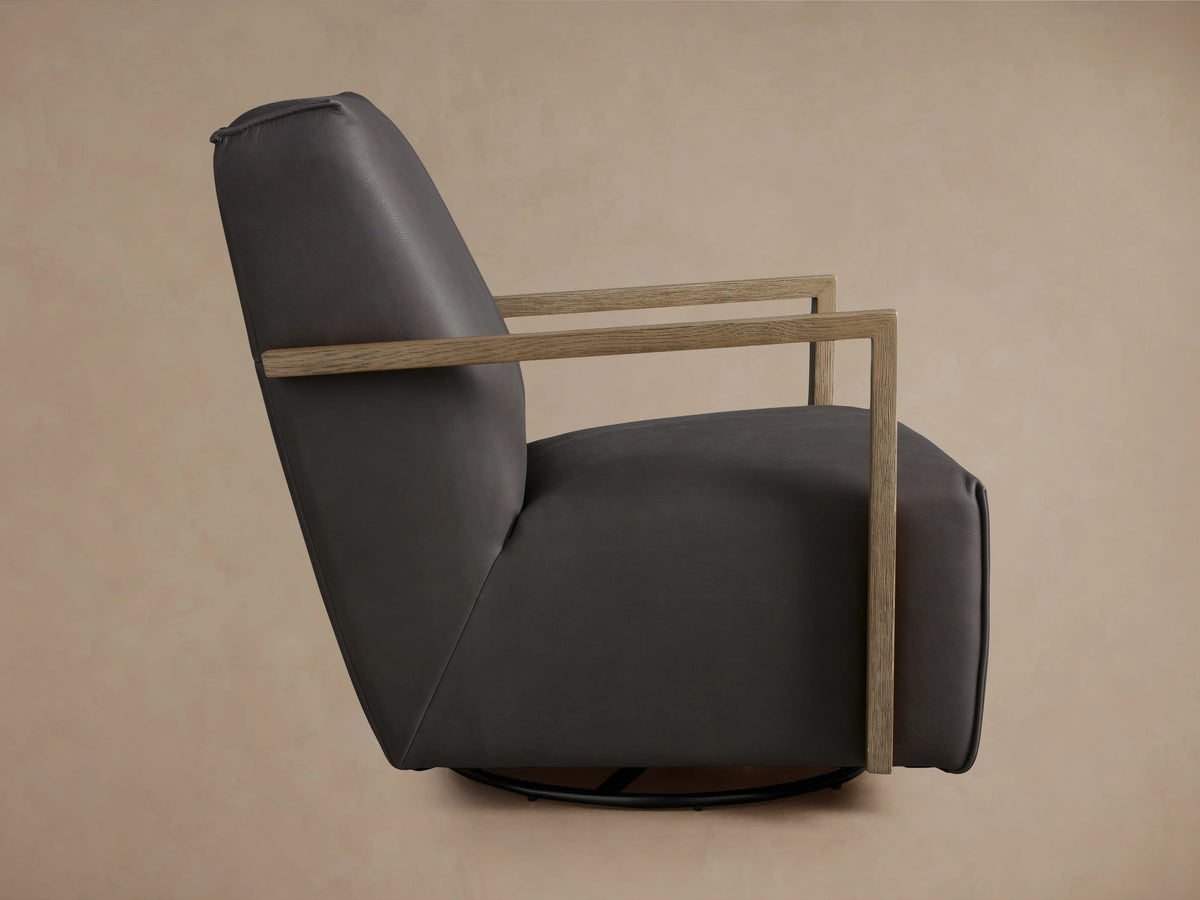 Walsh Leather Glider with sleek, dark brown leather upholstery and modern wooden armrests on a neutral background.