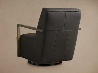 Walsh Leather Glider in dark brown leather featuring a sleek profile with wooden armrests and a swivel base on a neutral background.