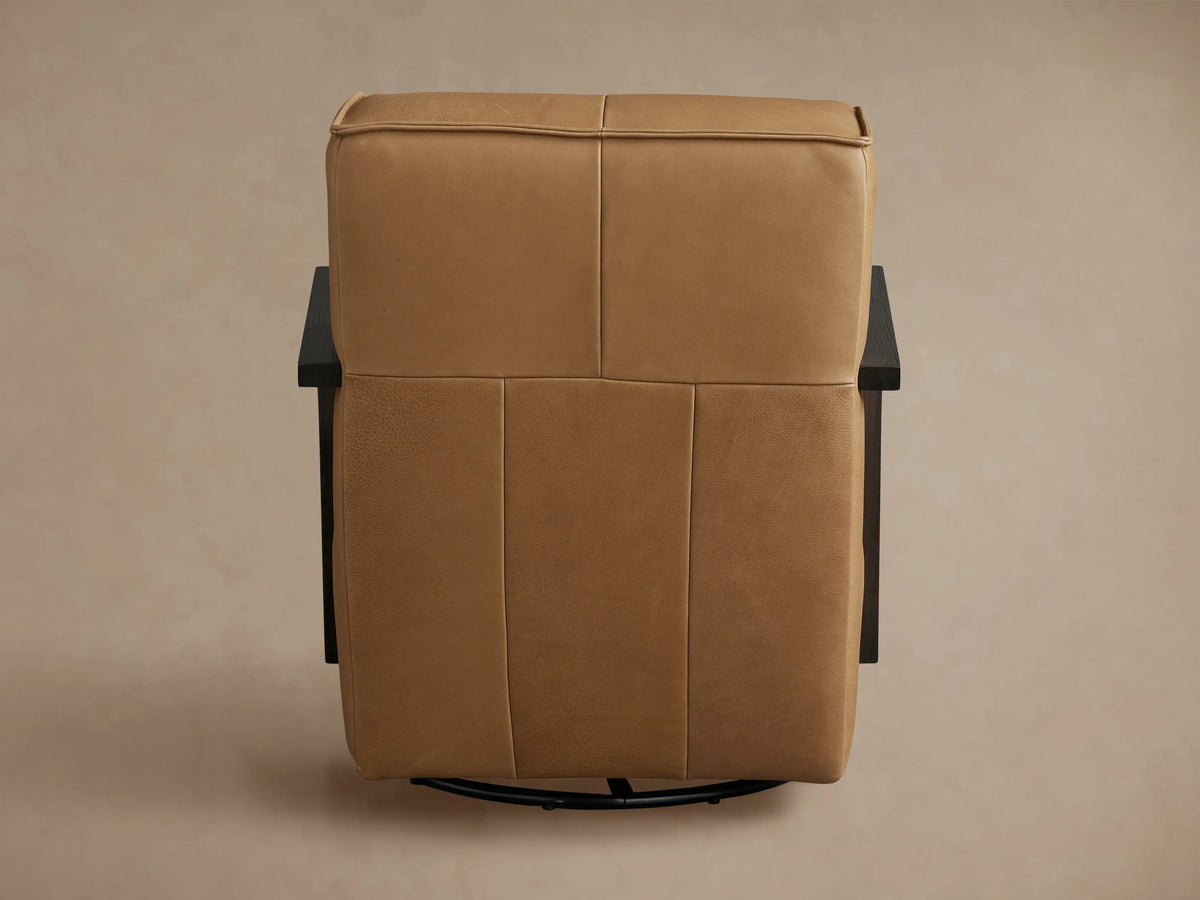 Tan Walsh Leather Glider, side view. Features smooth tan leather and dark wood square-profile armrests on a black base.