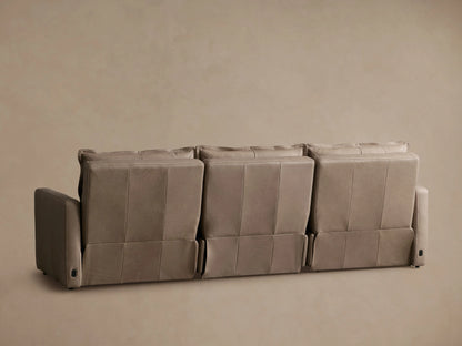 Rowland Leather Three-Piece Motion Modular Sofa in taupe color, featuring plush backrests and an armrest with a smooth leather finish.