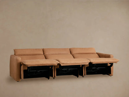 Rowland Tailored Leather Three-Piece Motion Modular Sofa in tan, fully reclined, showing extended footrests on beige wall.