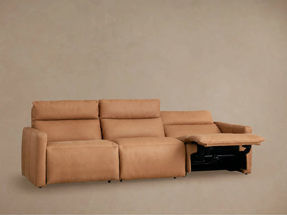 Rowland Tailored Leather Three-Piece Modular Sofa in tan, all sections reclined with footrests extended, against a light wall.