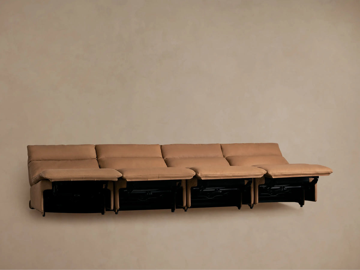 Rowland Tailored four-piece armless motion modular sofa in tan leather, with the rightmost seat fully reclined.