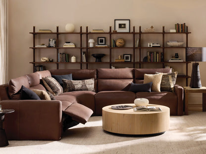Rowland Tailored light brown leather 5-piece motion corner sectional sofa with padded backrests on a wood floor.
