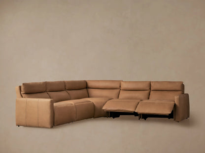 Rowland Tailored tan leather L-shaped 5-piece motion corner sectional, with two recliners extended, against a neutral wall.