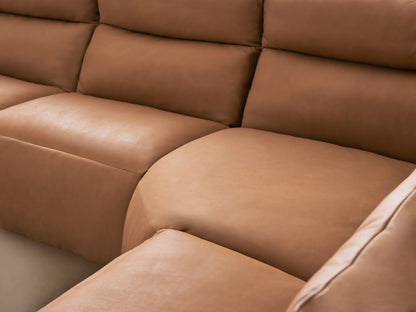 Rowland Tailored Leather Six-Piece Motion Sectional, L-shaped, light brown, with several of its motion footrests extended.