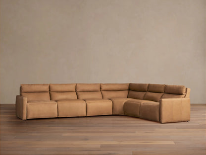Rowland Tailored Leather Six-Piece Motion Sectional, L-shaped in light brown, with plush cushions, on a wood floor.