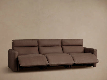 Back of a brown Rowland Tailored Leather Three-Piece Motion Modular Sofa, showing three connected recliner sections.
