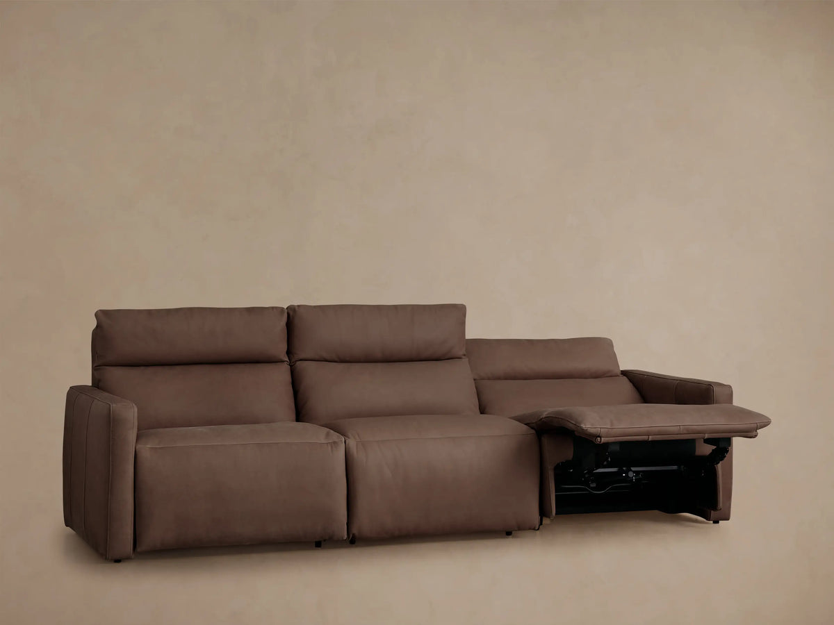 Rowland Tailored Leather Three-Piece Motion Modular Sofa in rich brown leather, fully reclined with footrests extended.