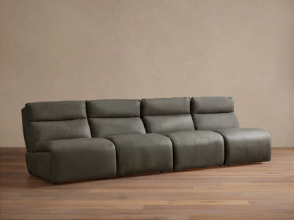 Rowland Tailored charcoal gray leather four-piece armless modular sofa on a wooden floor, against a light brown wall.
