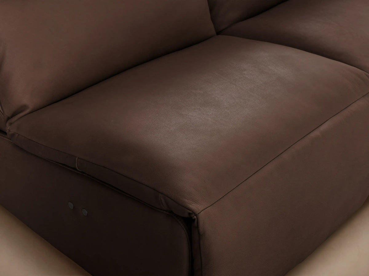 Rowland Tailored brown leather four-piece armless modular sofa, each unit a motion recliner, shown head-on in a studio.