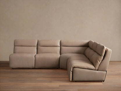Light taupe leather Rowland 5-piece armless motion corner sectional, its corner piece partially reclined on wood floor.