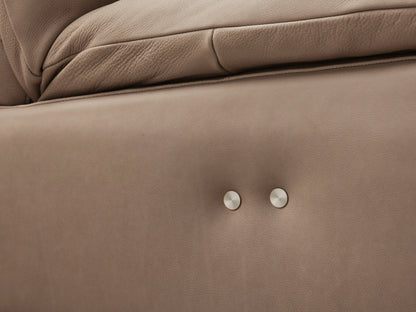 Taupe leather Rowland Tailored five-piece armless motion corner sectional, L-shaped, with segmented backrests, on wood floor.