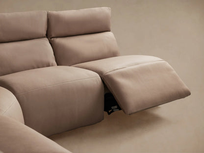 Close-up of Rowland Tailored Leather Sectional in light brown, showing textured leather and two silver control buttons.