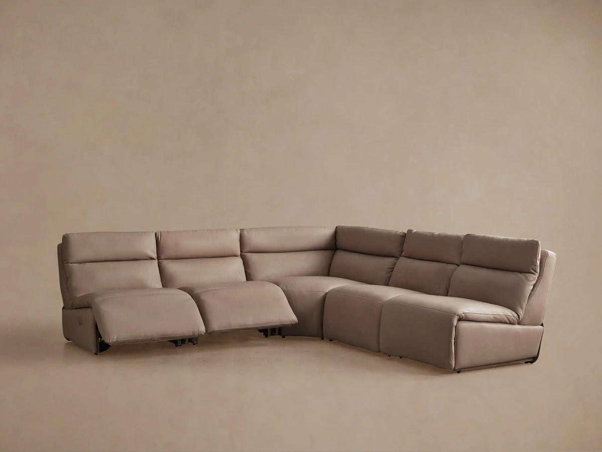 Rowland Tailored Leather Five-Piece Armless Motion Corner Sectional, light brown, with one seat partially reclined.