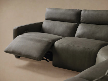 Close-up of dark gray textured leather Rowland Sectional backrest with two silver metal buttons and vertical stitching.