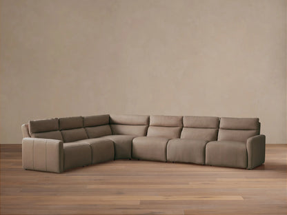 Rowland Tailored six-piece L-shaped motion sectional in light brown leather, positioned on a light wood floor.