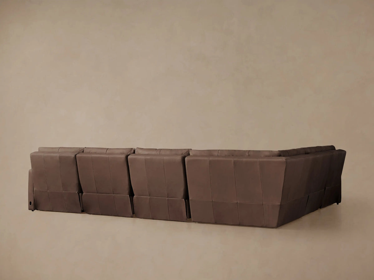Close-up of Rowland Tailored Leather Six-Piece Motion Sectional, showing rich brown leather seat and back cushions.