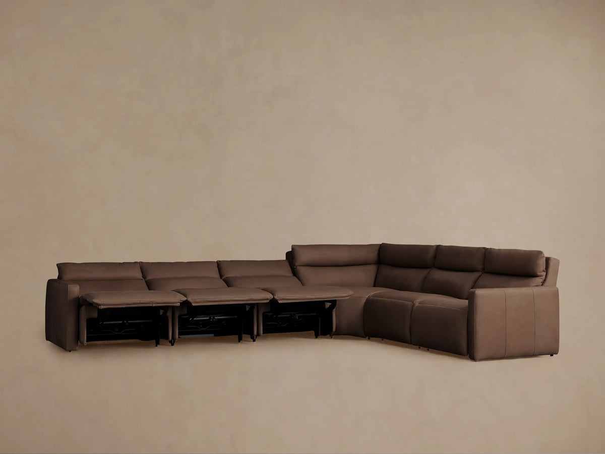 Dark brown Rowland Tailored Leather Six-Piece Motion Sectional. Four recliners are extended, forming an L-shape.