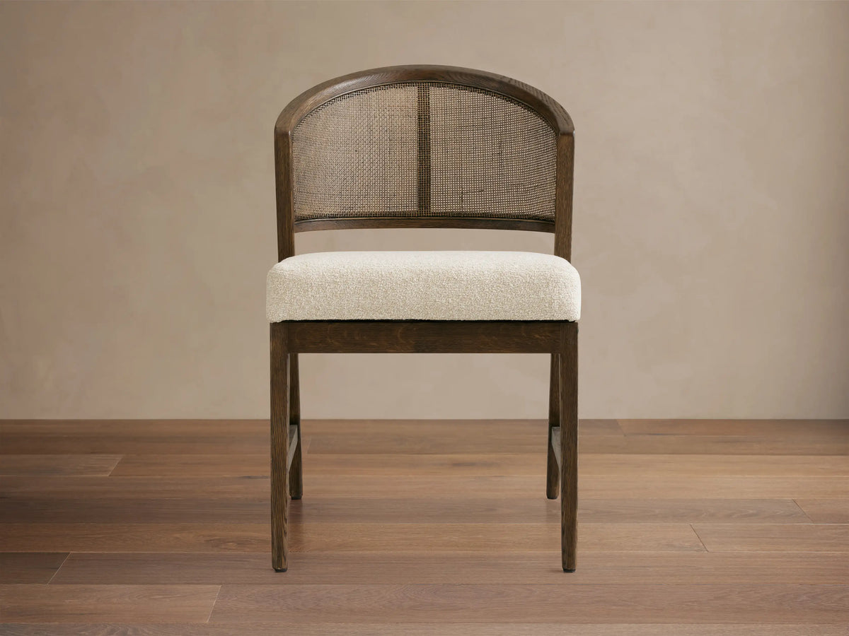 Dining room featuring the Aimee Dining Side Chair, with dark solid oak frame, rattan cane back, and upholstered cushion.