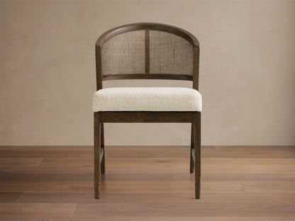 Dining room featuring the Aimee Dining Side Chair, with dark solid oak frame, rattan cane back, and upholstered cushion.