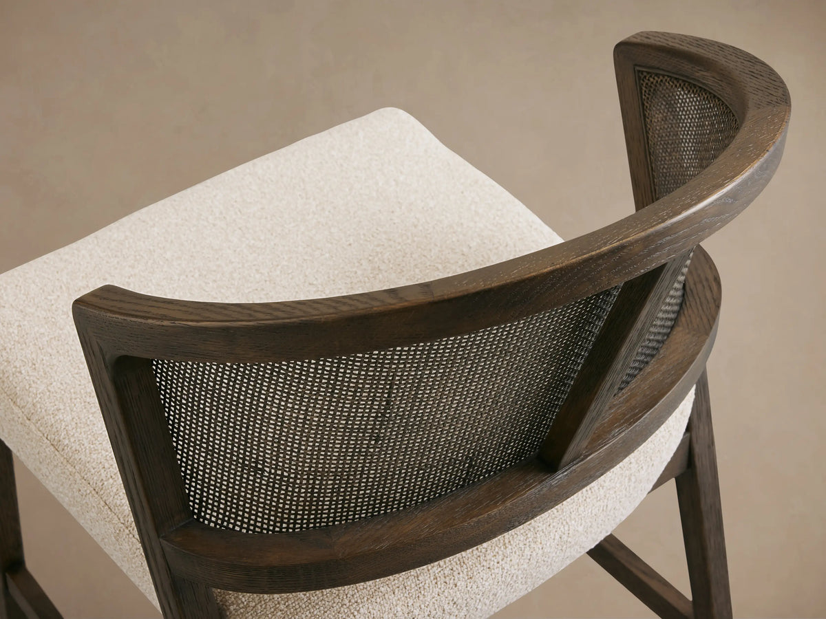 Aimee Dining Side Chair with solid oak frame, rattan cane back, upholstered beige cushion, and black driftwood finish.