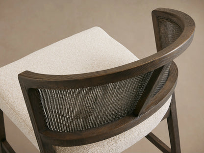 Aimee Dining Side Chair with solid oak frame, rattan cane back, upholstered beige cushion, and black driftwood finish.
