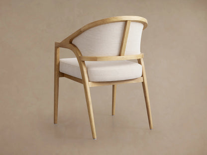 Aimee Upholstered Back Dining Arm Chair, featuring a light oak frame with a cream upholstered seat and back, on a wooden floor.