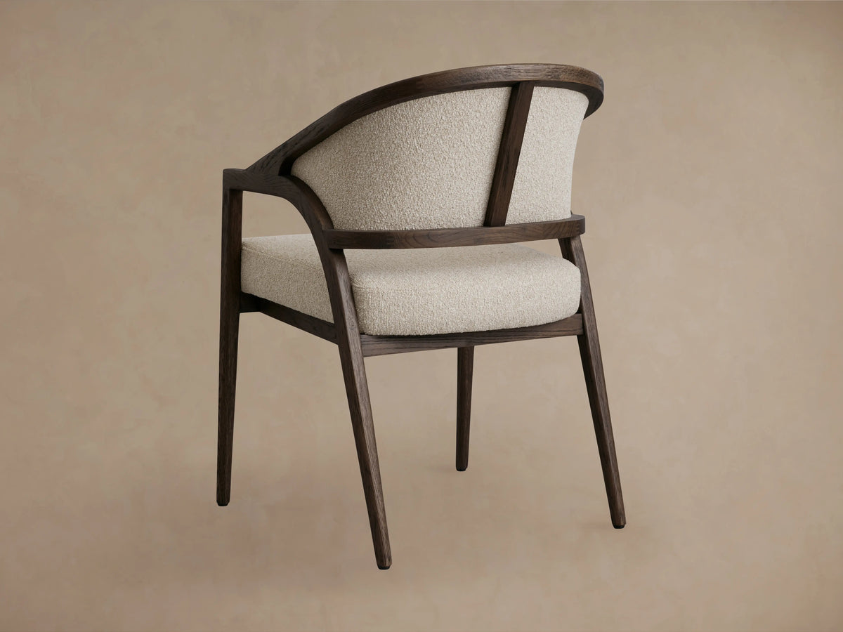 Aimee Dining Arm Chair with cream upholstered back and seat, dark oak frame, seen from above at an angle.