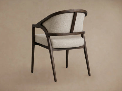 Aimee Dining Arm Chair with cream upholstered back and seat, dark oak frame, seen from above at an angle.