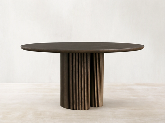 Astor Round Dining Table with oak veneer top, reeded solid oak base, and inset natural marble accents on a wooden floor.