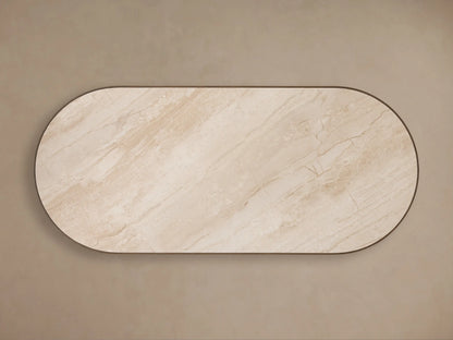 Astor Dining Table. Angled close-up of natural light beige marble top with subtle veining and dark solid oak reeding.