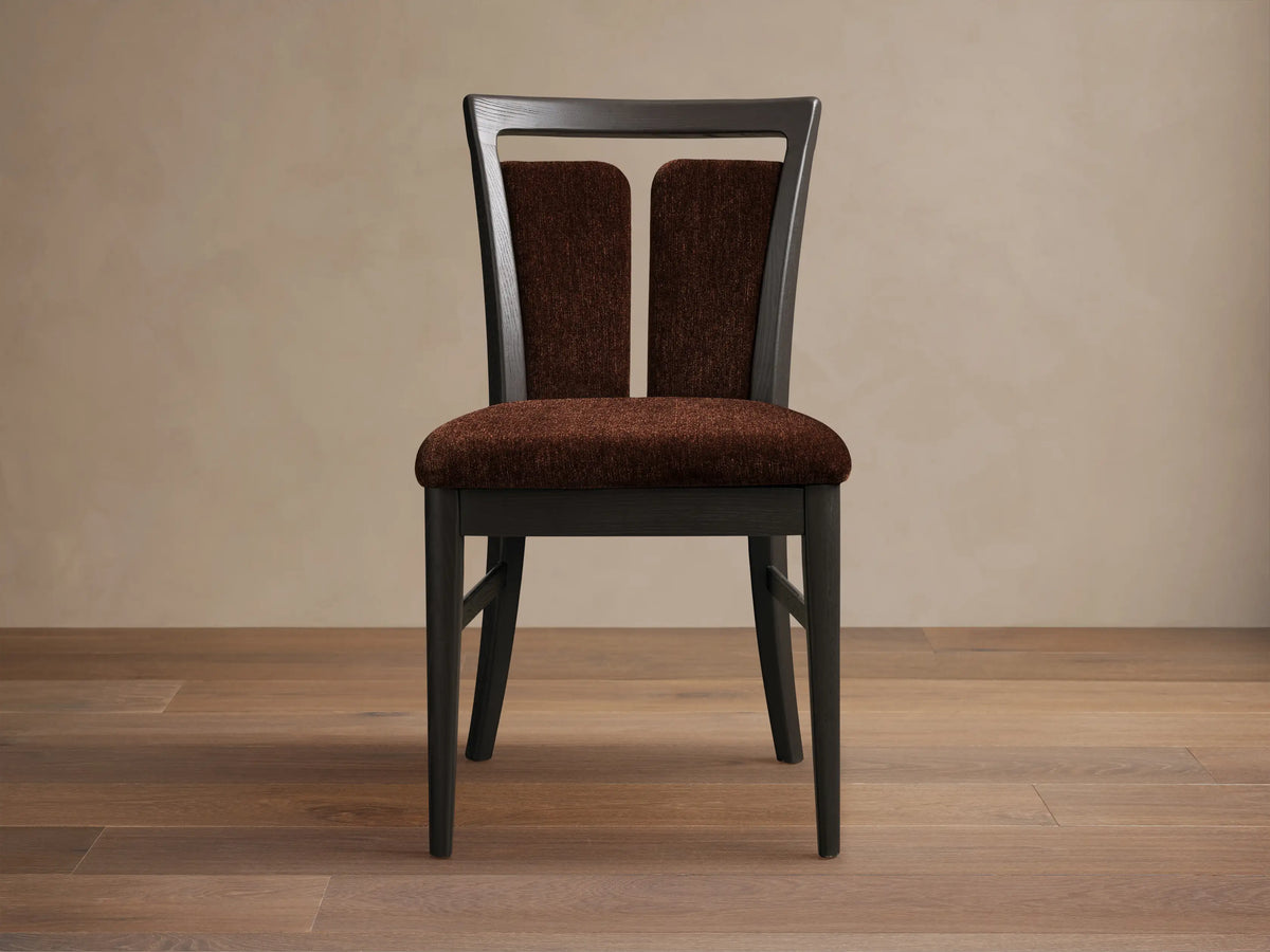 Front view of the dark ash wood Beatrice Dining Side Chair with brown fabric upholstery and a signature split-back design.